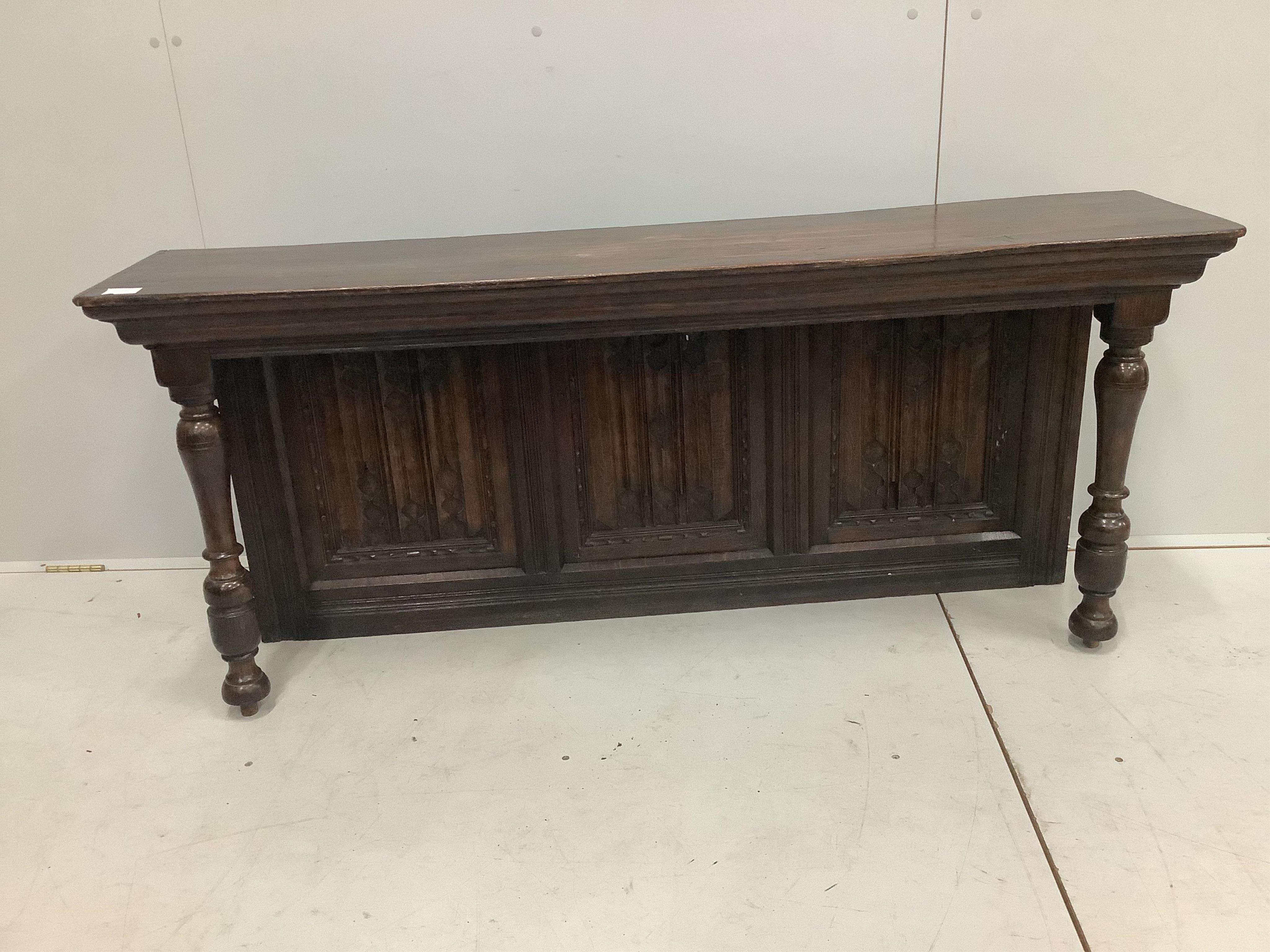 A section of linen fold panelling mounted as a sideboard back, width 165cm, height 65cm. Condition - good